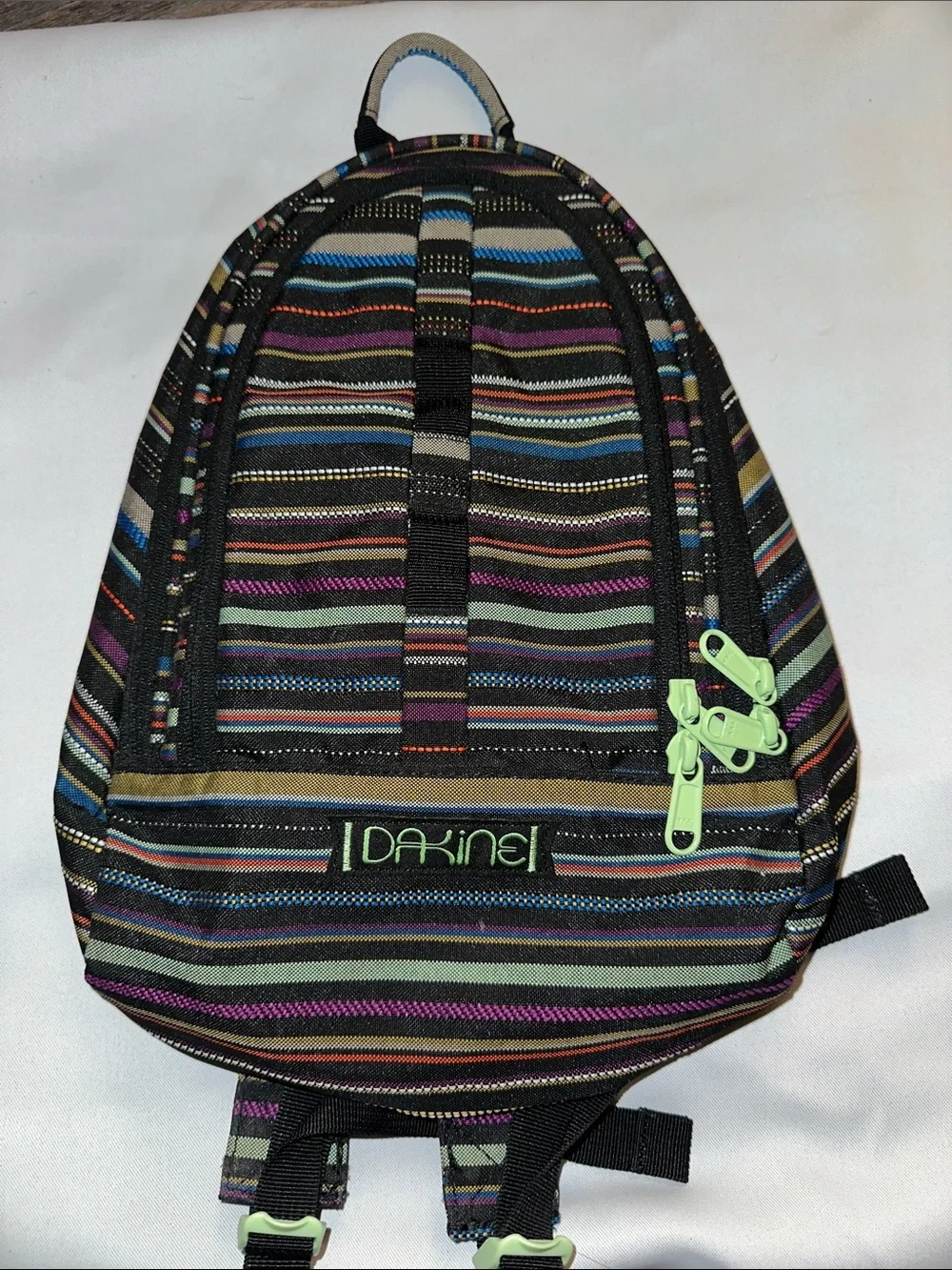 Dakine women’s Striped Backpack in Black, Blue, Purple, Green